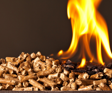 Wood pellets burning with a bright flame